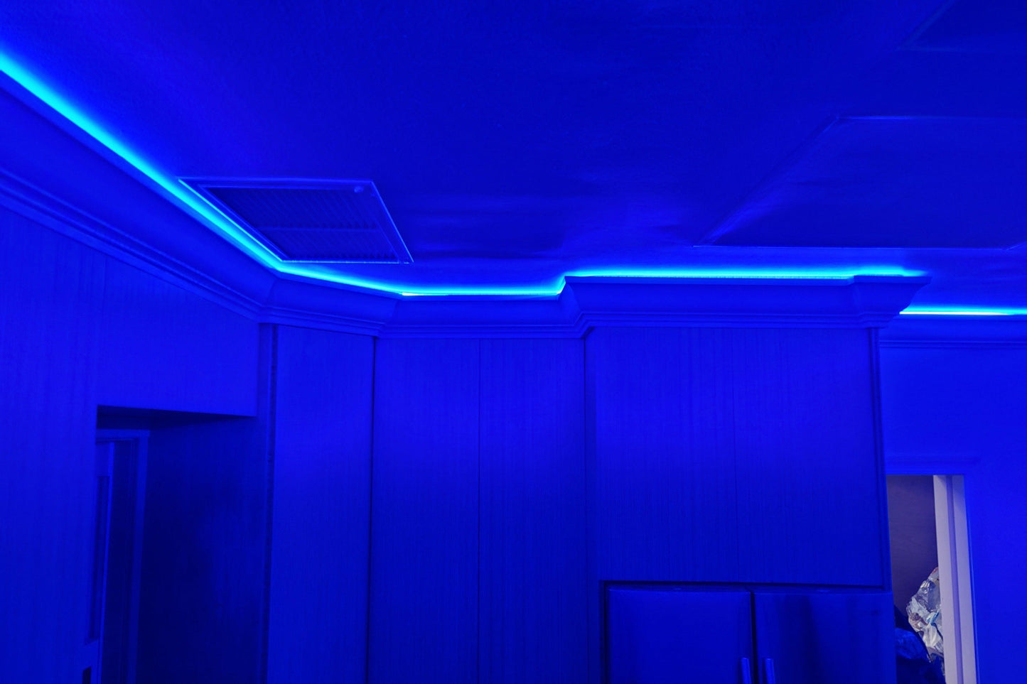 Illuminated crown molding with blue ambient light  